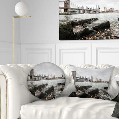 Designart 'Brooklyn Bridge with Rocks on Shore' Cityscape Throw Pillow