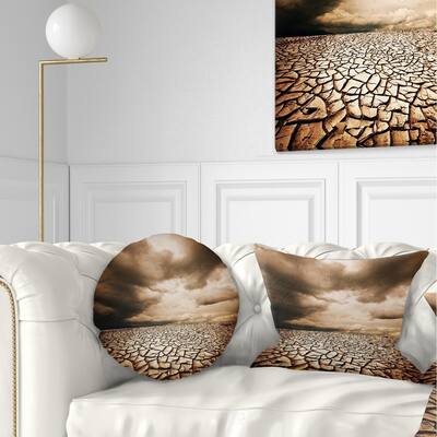 Designart 'Cracked Drought Land with Dark Clouds' Landscape Printed Throw Pillow