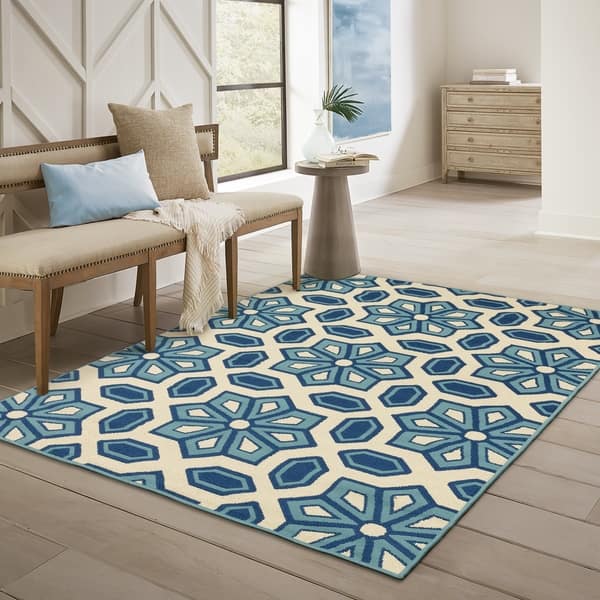 https://ak1.ostkcdn.com/images/products/21247665/Carson-Carrington-Skovde-Tiles-Ivory-Blue-Indoor-Outdoor-Area-Rug-67-x-96-c7aaee16-d0f1-402d-a8da-8e1b31429b73_600.jpg?impolicy=medium