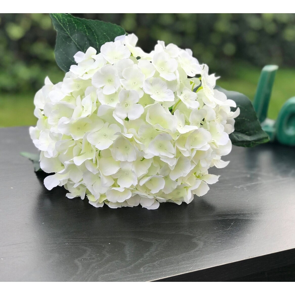 winter white artificial flowers arrangement in glass vase. Faux hydrangeas,  white peony and skimmia — Victoria James Floral Designs