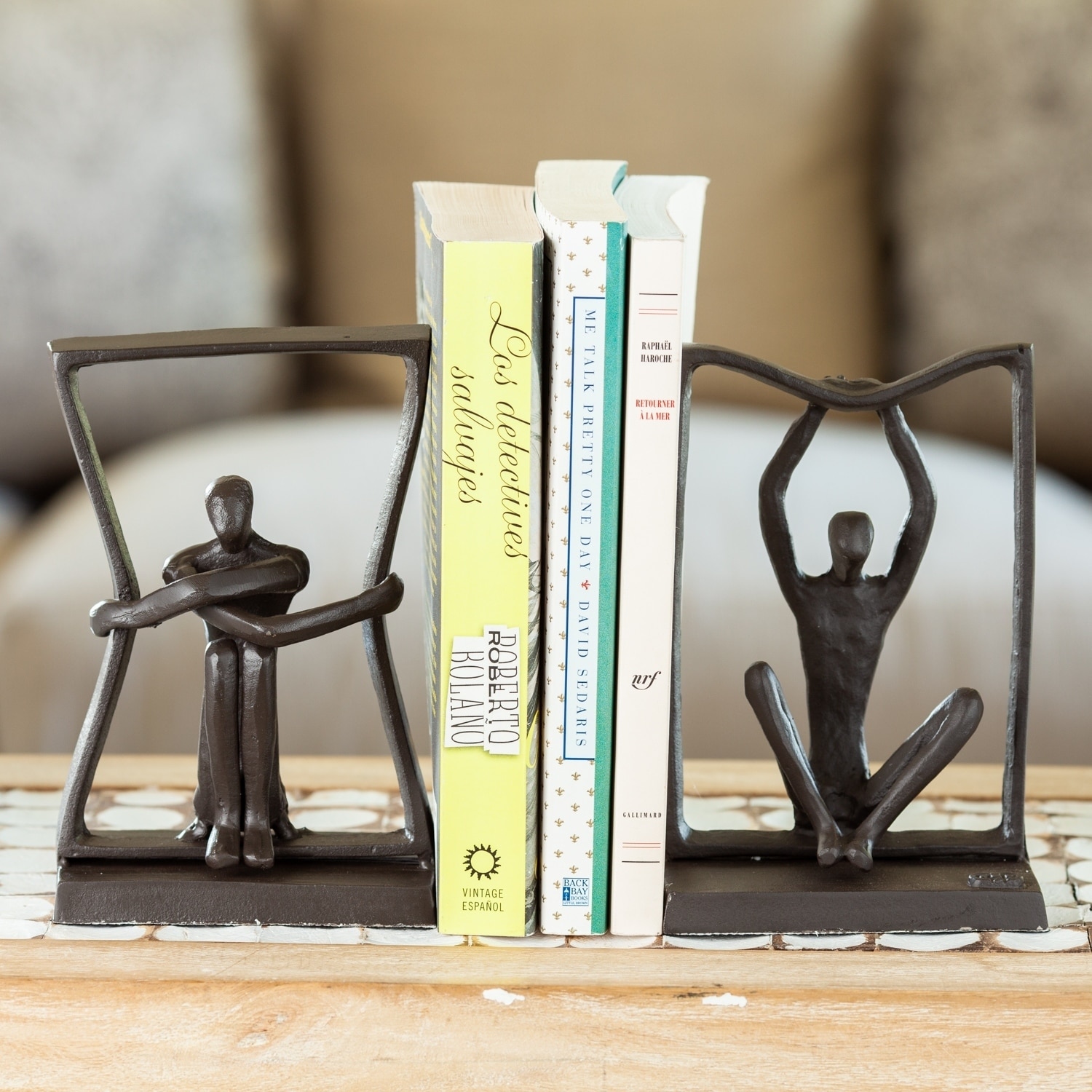 Danya B Man and Woman Sitting on a Block Metal Bookend Set