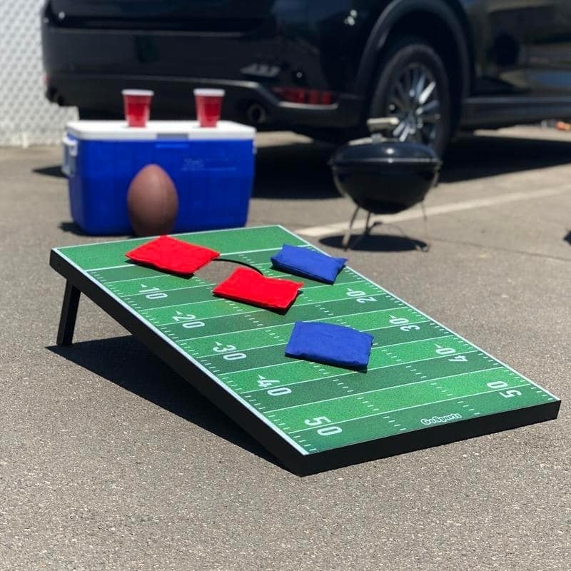 GoSports Football Cornhole Set | Customize with Your Team's Decals | Includes 2 Boards, 8 Bean Bags & Case - Green - 3' x 2'