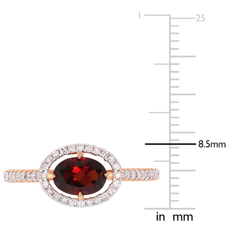 Miadora 10k Rose Gold Garnet and 1/4ct TDW Diamond Floating Oval Halo Ring