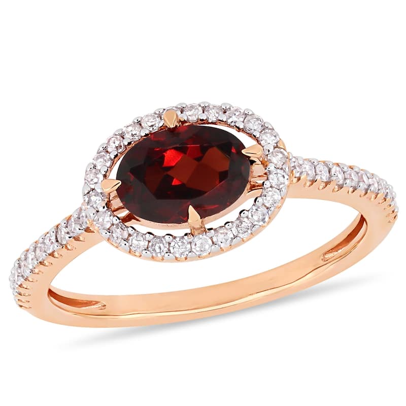 Miadora 10k Rose Gold Garnet and 1/4ct TDW Diamond Floating Oval Halo Ring
