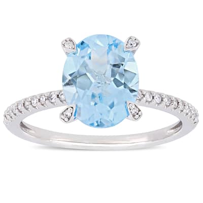 Miadora 10k White Gold Oval-Cut Sky-Blue Topaz and 1/10ct TDW Diamond Solitaire Ring