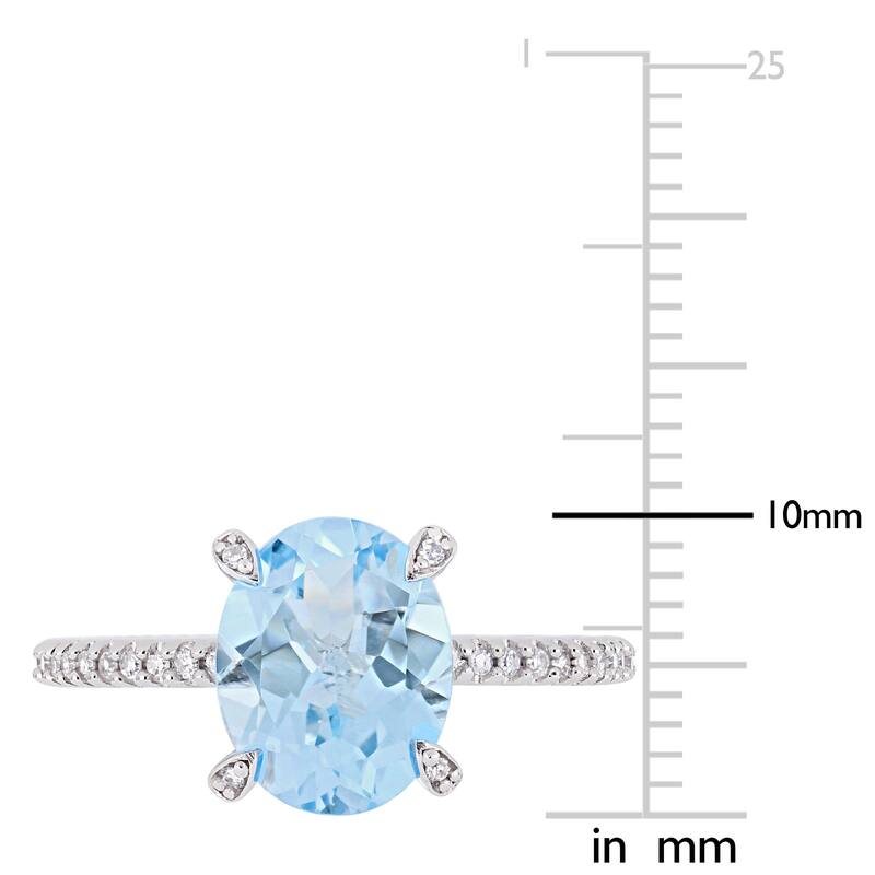 Miadora 10k White Gold Oval-Cut Sky-Blue Topaz and 1/10ct TDW Diamond Solitaire Ring
