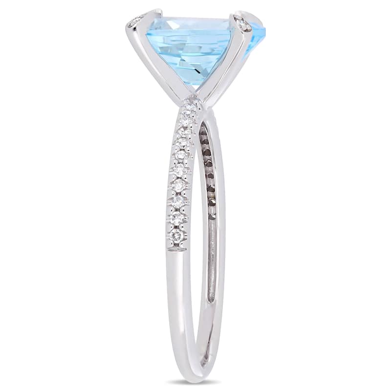 Miadora 10k White Gold Oval-Cut Sky-Blue Topaz and 1/10ct TDW Diamond Solitaire Ring