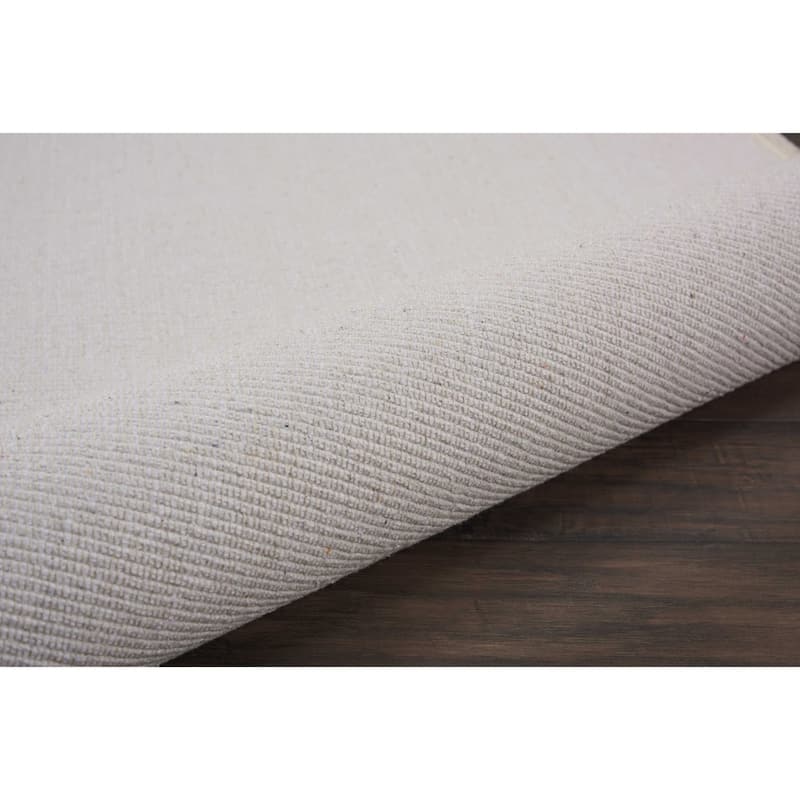 Nourison Otto Solid Tassel Area Rug