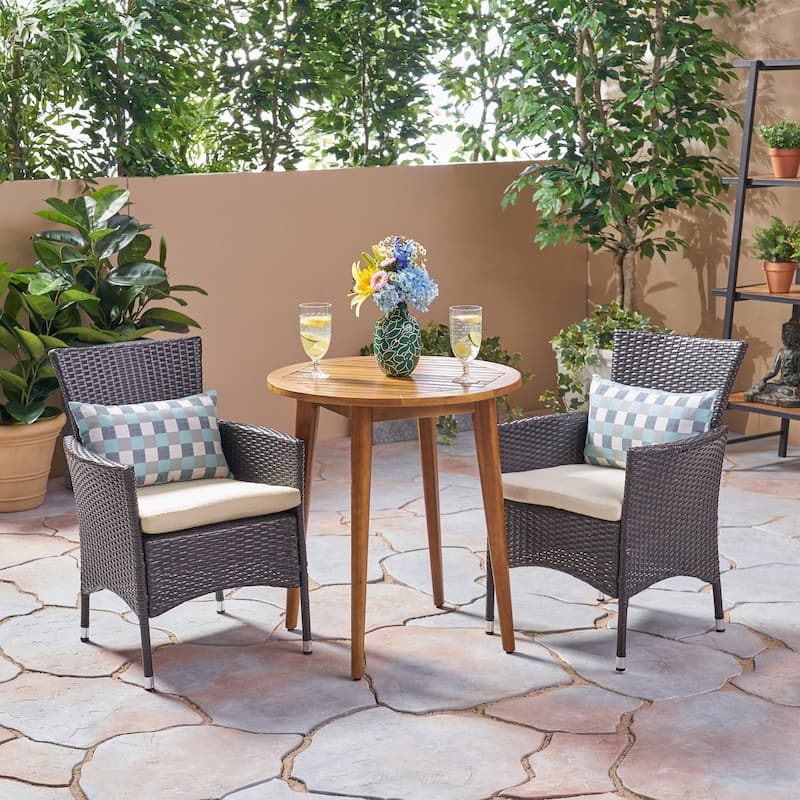 Bruna Outdoor 3 Piece Wood and Wicker Bistro Set by Christopher Knight Home - teak finish + multi brown + beige cushion