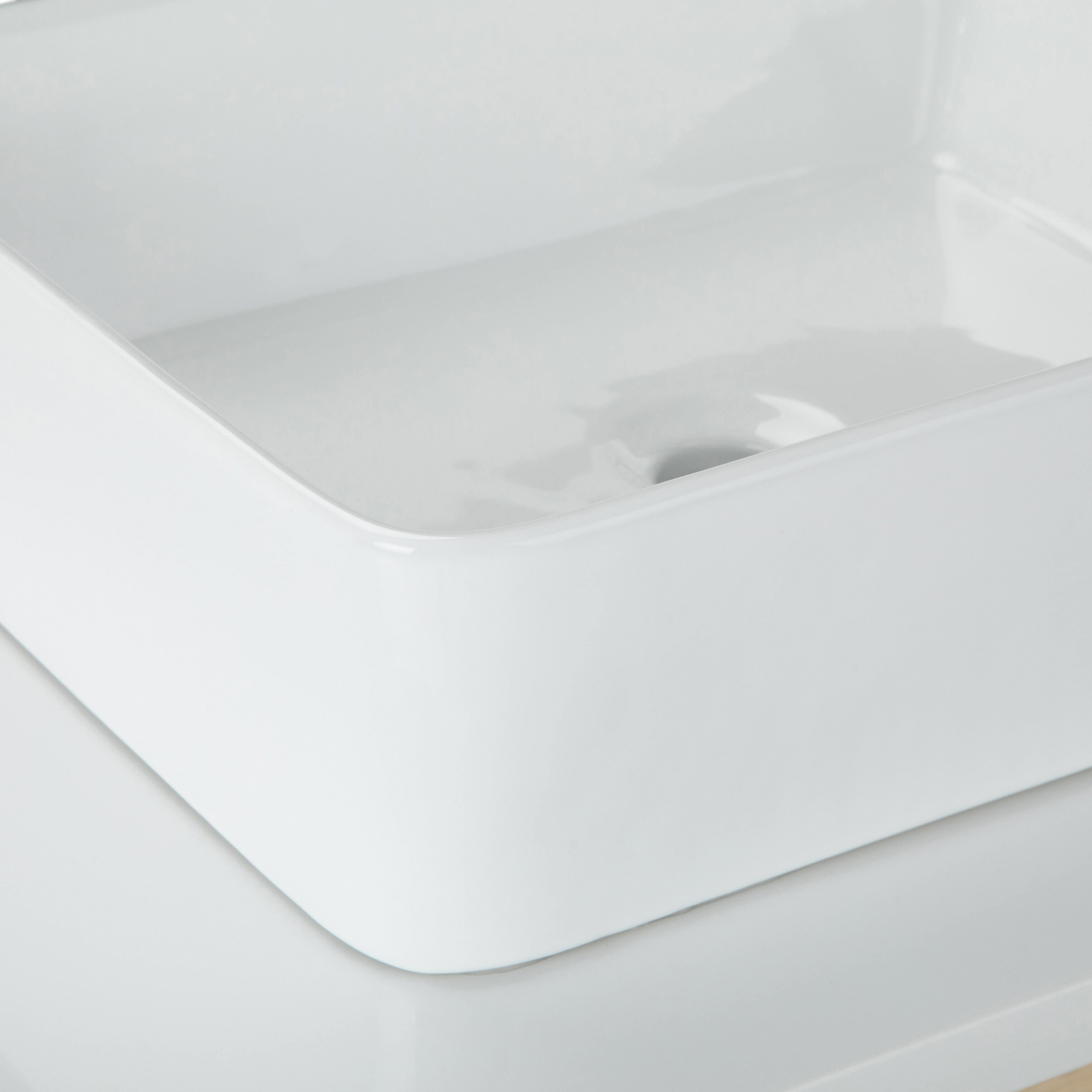White rectangular vessel sink.