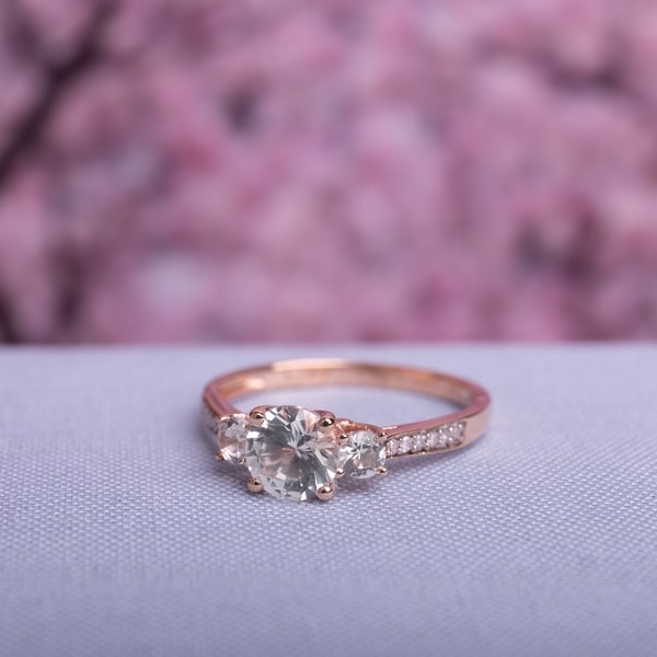 3-Stone Created White Sapphire and Diamond Engagement in 10k Rose Gold by Miadora. Opens flyout.