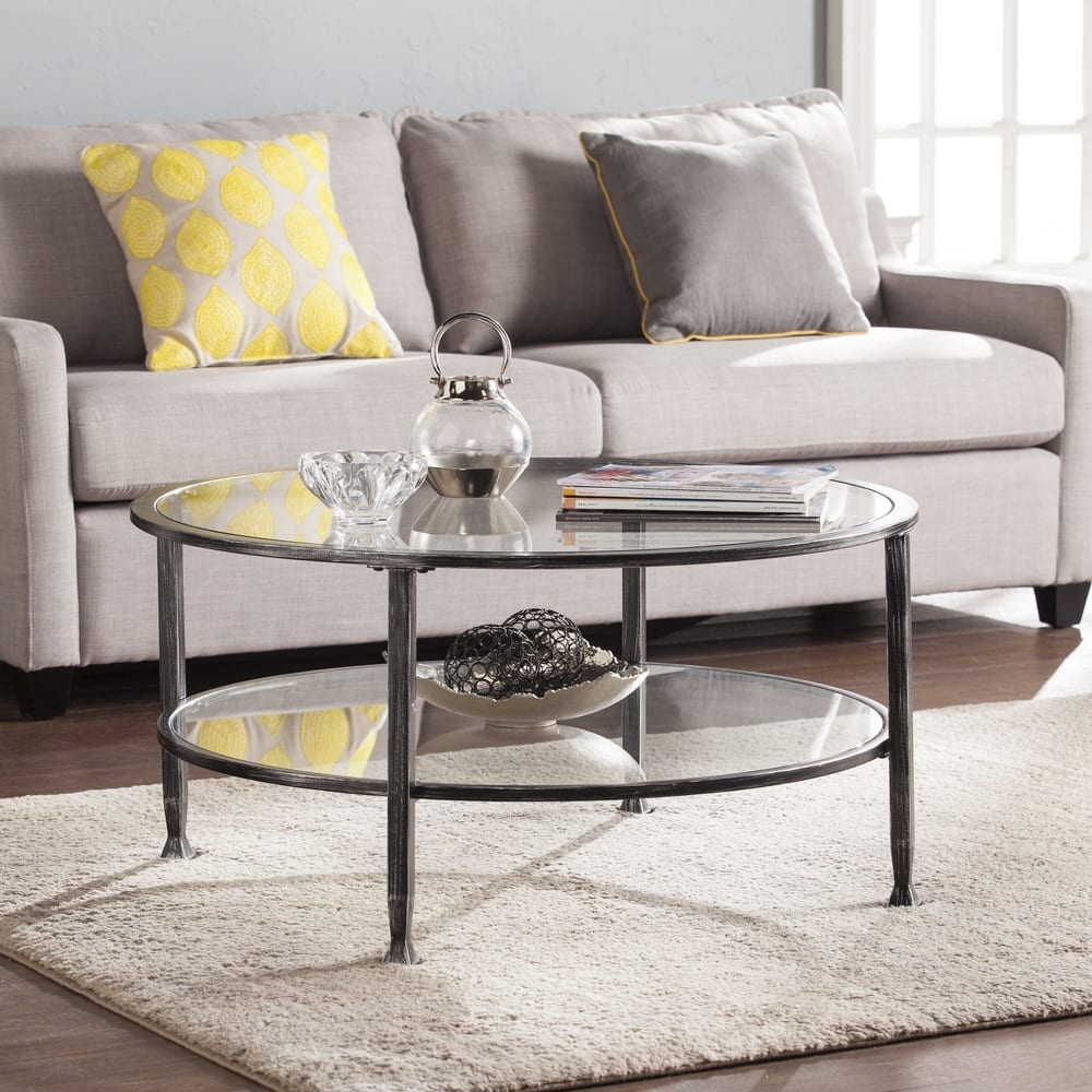 SEI Furniture Glenn Distressed Black Metal Round CoffeeTable with Glass Top and Shelf