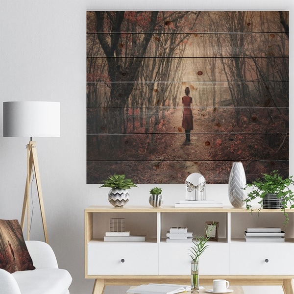 Designart 'Woman in Frosty Forest' Landscape Photography Print on Natural Pine Wood - Red