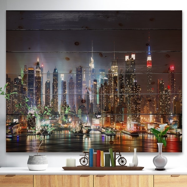 Designart 'Lit NYC Manhattan Skyline' Cityscape Photo Print on Natural Pine Wood - Brown