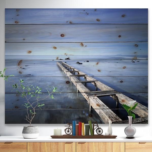 Designart 'Dark Blue Sky and Large Pier' Seascape Print on Natural Pine Wood