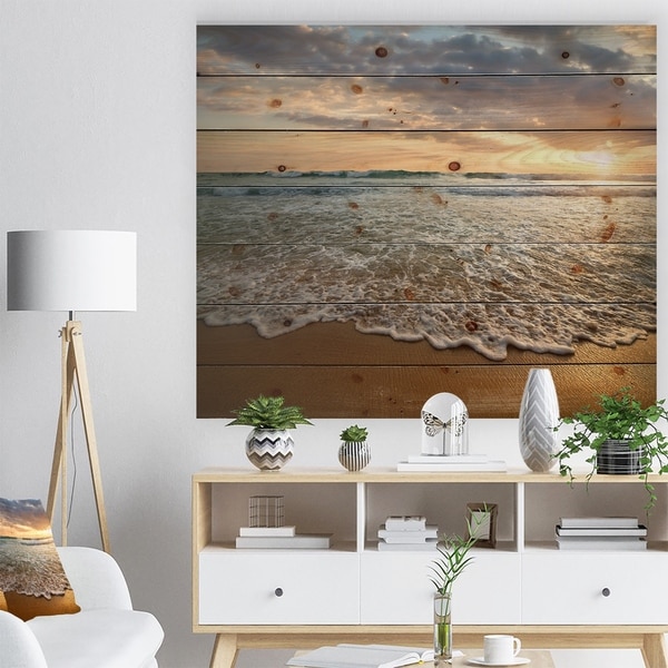 Designart 'Bright Cloudy Sunset in Calm Ocean' Seashore Print on Natural Pine Wood - Blue