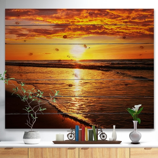 Designart 'Bright Yellow Sunset over Waves' Modern Beach Print on Natural Pine Wood