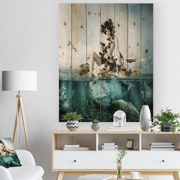 Designart 'Woman Seating on Shell' Modern Sea & Shore Print on Natural Pine Wood - Blue