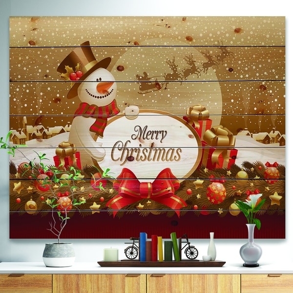 Designart 'Christmas Sowman on Gold with Flying Reindeer' Print on Natural Pine Wood - yellow & gold