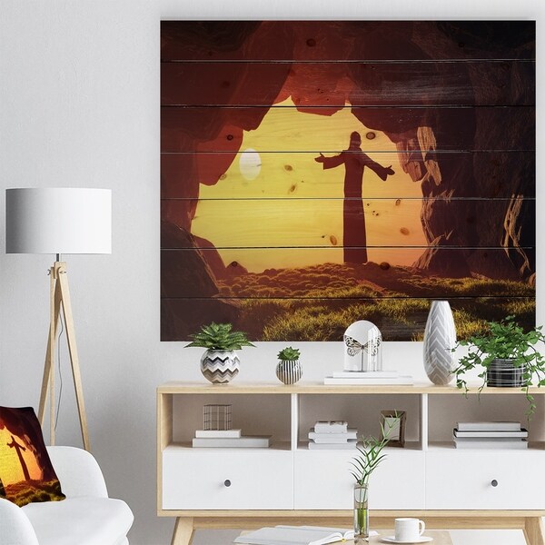 Designart 'Man Praying in Cave Under Sunset' Religious Contemporary Print on Natural Pine Wood - Brown