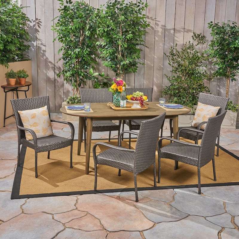 Elderon Outdoor 7 Piece Acacia Wood Dining Set with Stacking Wicker Chairs by Christopher Knight Home