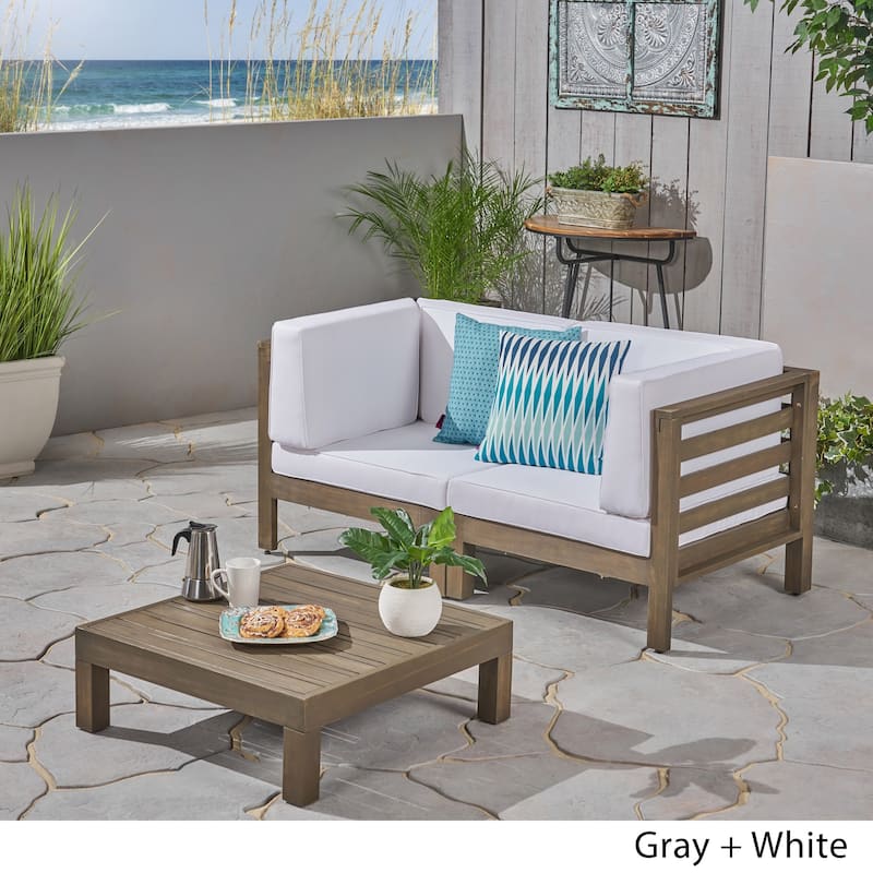 Oana Outdoor 2-Seater Acacia Wood Sectional Loveseat and Coffee Table Set with Cushions by Christopher Knight Home