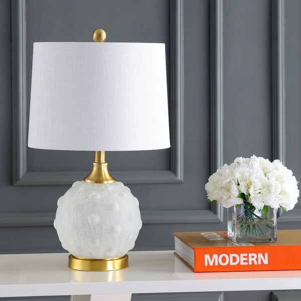 white and brass table lamp