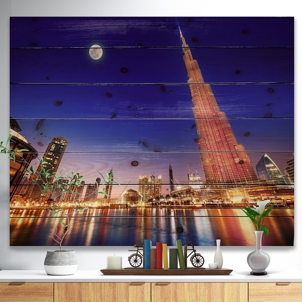 Designart 'Burj Khalifa Night Landscape' Cityscape Print on Natural Pine Wood - Multi-color