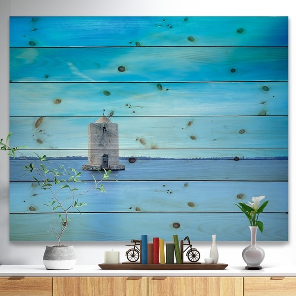 Designart 'Old Spanish Windmill in Blue Lagoon' Seashore Print on Natural Pine Wood