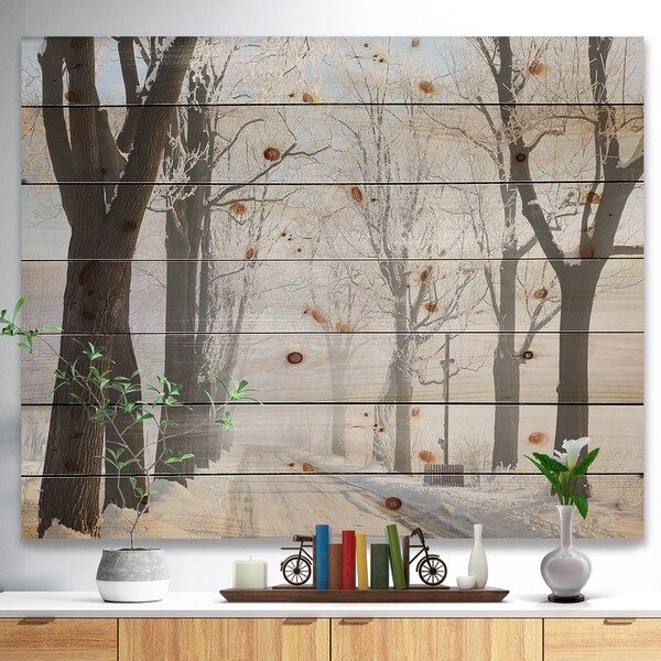 Designart 'Misty Rural Road in Winter Forest' Forest Print on Natural Pine Wood - White