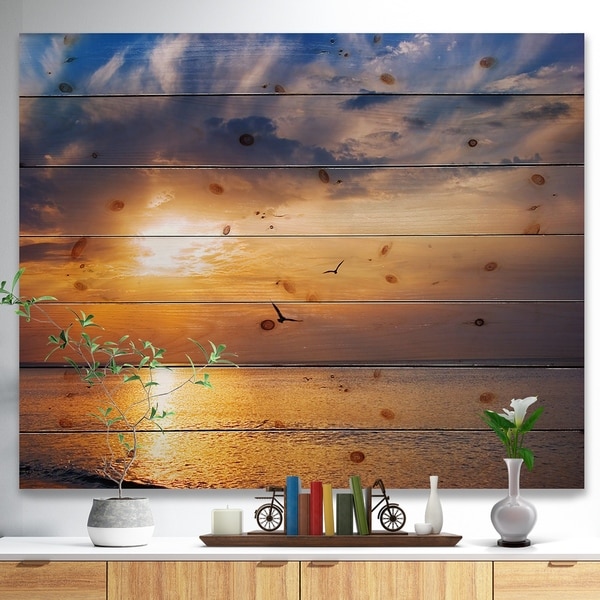 Designart 'West Cost Sunrise Over The seas' Landscapes Sea & Shore Print on Natural Pine Wood - Brown