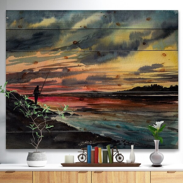Designart 'Fishing Man over Sunset Sky' Landscapes Painting Print on Natural Pine Wood - Blue
