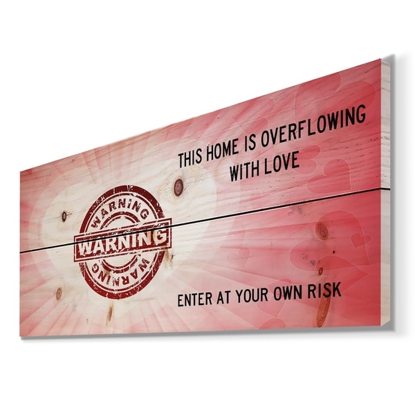 Designart 'Warning. This house is Overflowing with love. Pink Heart' Textual Entrance Art on Wood Wall Art - Red