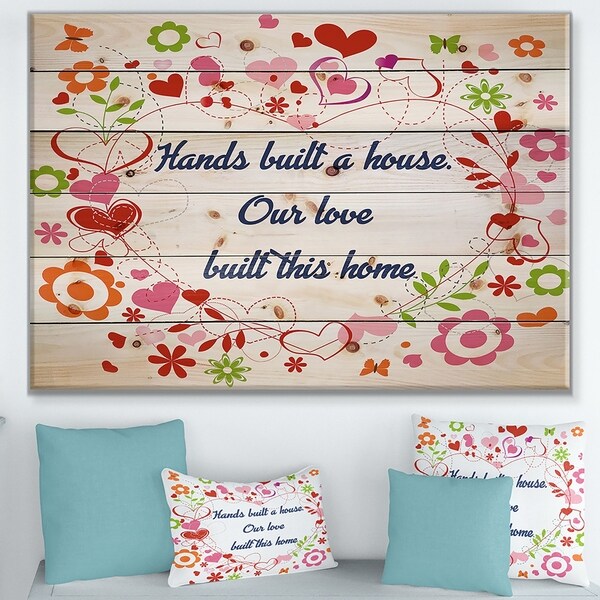 Designart 'Hands built a house. Floral heart' Textual Entrance Art on Wood Wall Art - Blue/Pink