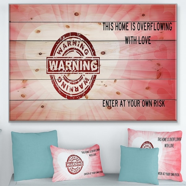 Designart 'This house is Overflowing with love. Pink heart Warning' Textual Entrance Art on Wood Wall Art - Red