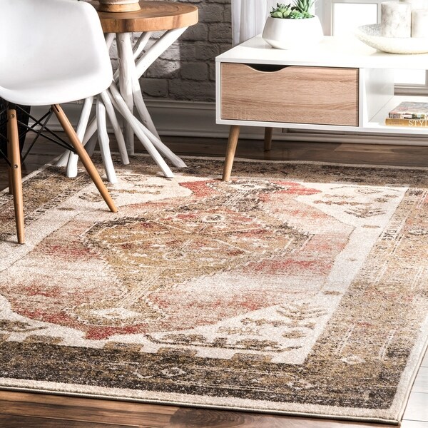 The Curated Nomad De Haro Orange Vintage Aztec Faded Border Area Rug