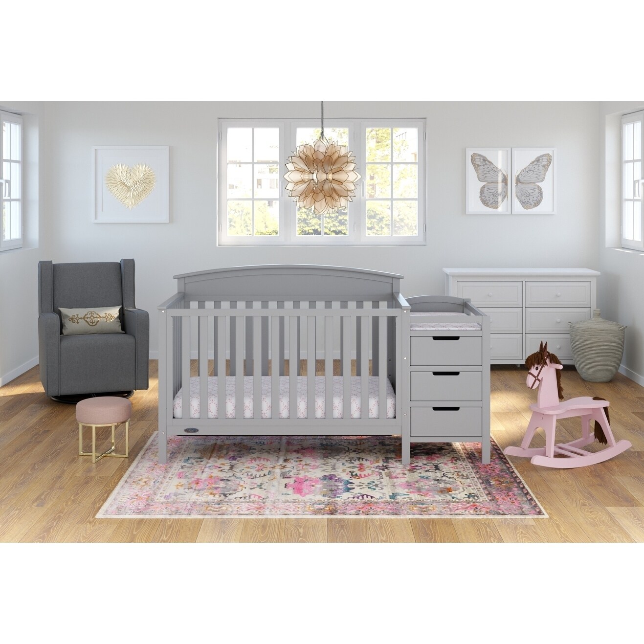 pink crib with changing table