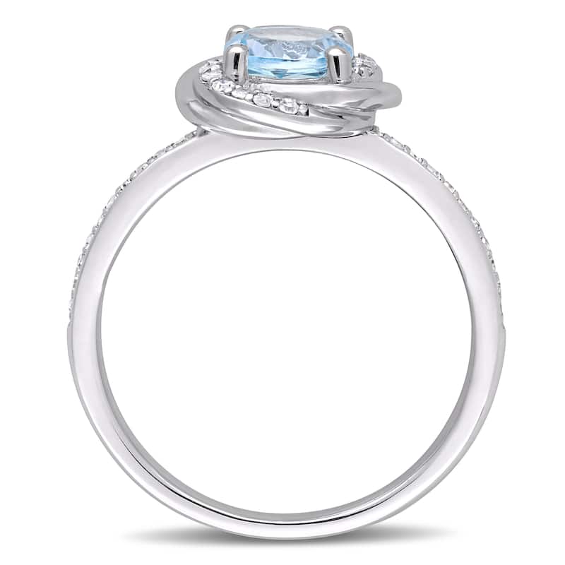 Miadora 10k White Gold Sky-Blue Topaz and 1/6ct TDW Diamond Swirl Halo Ring