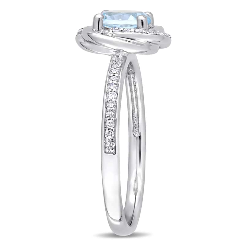 Miadora 10k White Gold Sky-Blue Topaz and 1/6ct TDW Diamond Swirl Halo Ring
