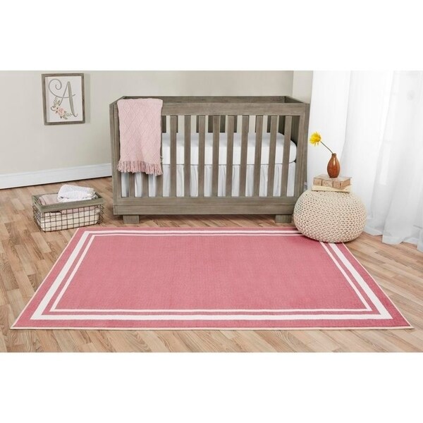 Pink and white sales nursery rug