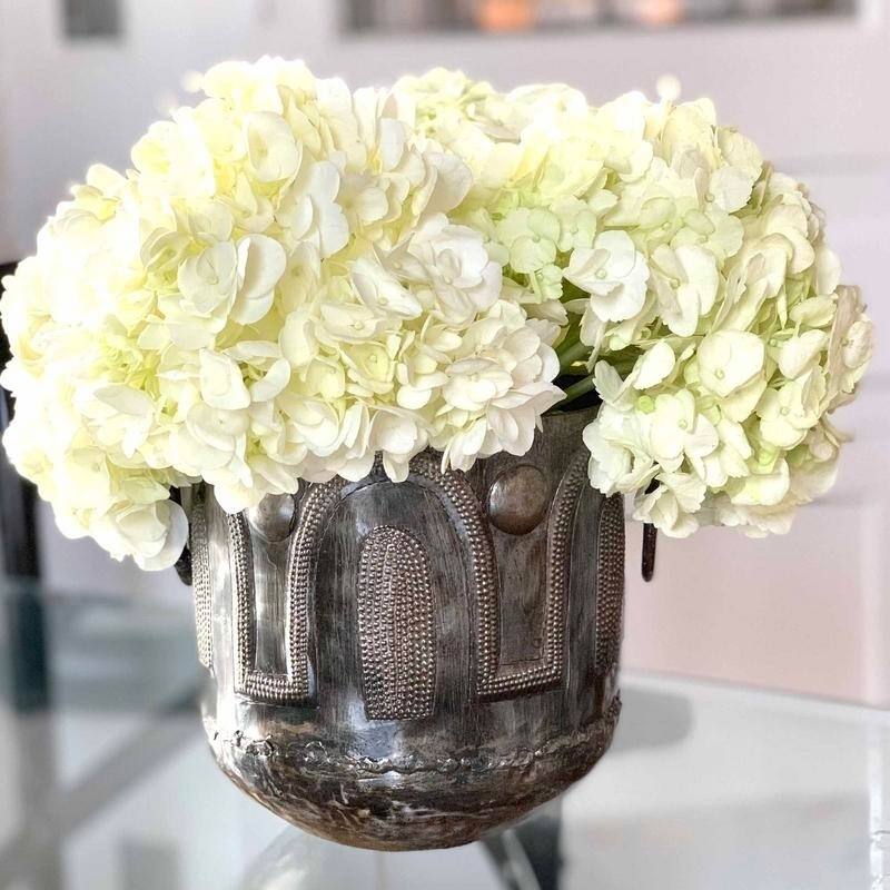 The Curated Nomad Haitia Handmade Hammered Metal Round Container with Handles