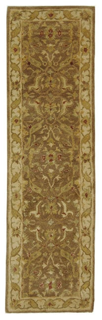 Handmade Antiquities Treasure Brown/ Gold Wool Runner (23 X 8) (BrownPattern OrientalMeasures 0.625 inch thickTip We recommend the use of a non skid pad to keep the rug in place on smooth surfaces.All rug sizes are approximate. Due to the difference of 