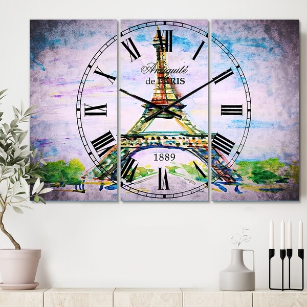 Designart 'Paris Eiffel Toweragainst Blue Sky' Cottage 3 Panels Large Wall CLock - 36 in. wide x 28 in. high - 3 panels