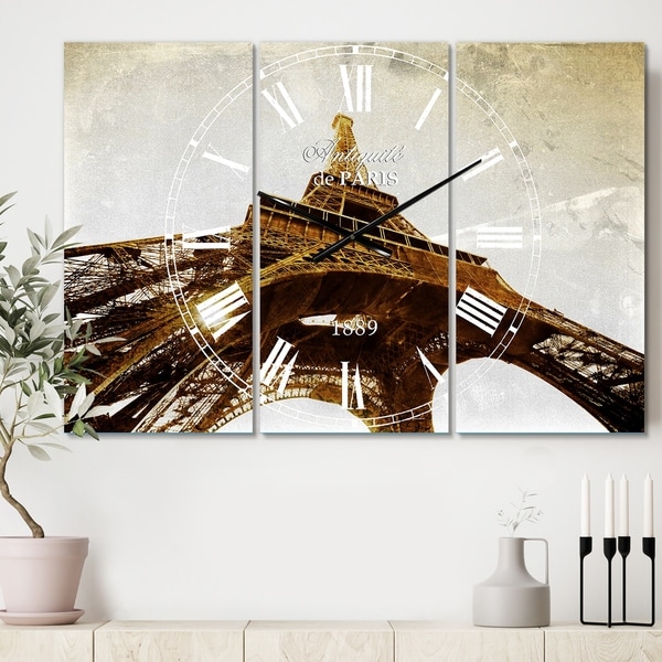 Designart 'Paris Eiffel TowerStraight Into Sky' Cottage 3 Panels Large Wall CLock - 36 in. wide x 28 in. high - 3 panels