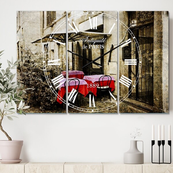 Designart 'Restaurant Terrace on the street' Cottage 3 Panels Oversized Wall CLock - 36 in. wide x 28 in. high - 3 panels