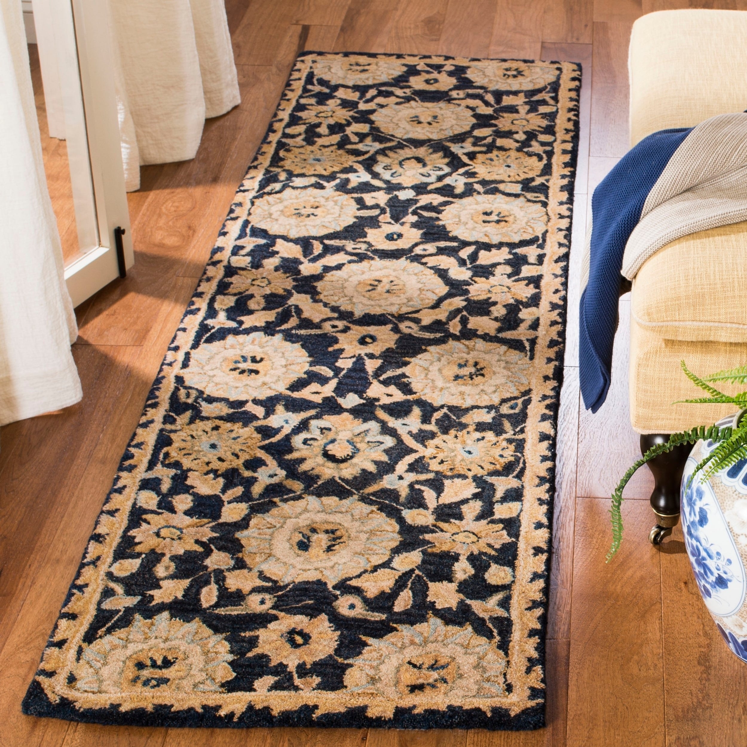 Handmade Medallions Navy Wool Runner (23 X 10) (BluePattern OrientalMeasures 0.625 inch thickTip We recommend the use of a non skid pad to keep the rug in place on smooth surfaces.All rug sizes are approximate. Due to the difference of monitor colors, s