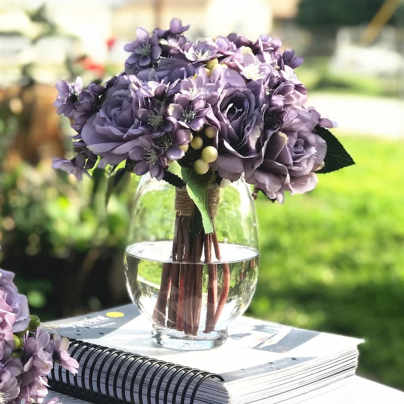 Enova Home Artificial Purple Silk Roses and Mixed Fake Flowers Arrangement in Clear Round Glass Vase with Faux Water