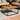 Brosnan Black/ Natural Wood Outdoor Coffee Table by SEI Furniture