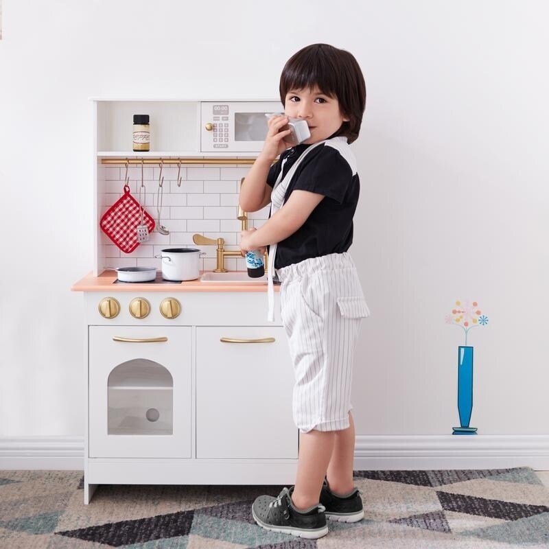 white and gold play kitchen