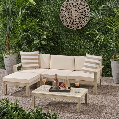 Tan outdoor acacia wood sofa sectional set with matching striped pillows available online at Overstock